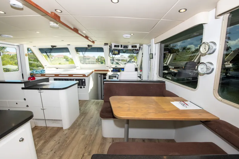 Sarah B Yacht Photos Pics Interior of 2007 Custom Carolina 58 Dixon Marine yacht with modern kitchen and dining area.