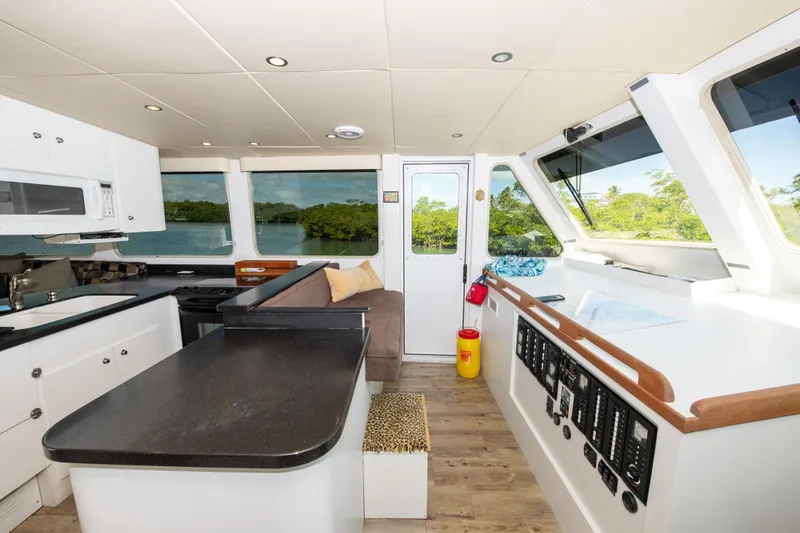 Sarah B Yacht Photos Pics Interior of 2007 Custom Carolina 58 Dixon Marine yacht with modern kitchen and seating area.