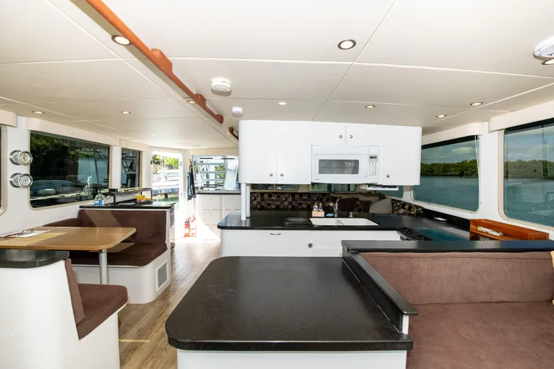 Sarah B Yacht Photos Pics Interior of 2007 Custom Carolina 58 Dixon Marine yacht, featuring modern kitchen and dining area.