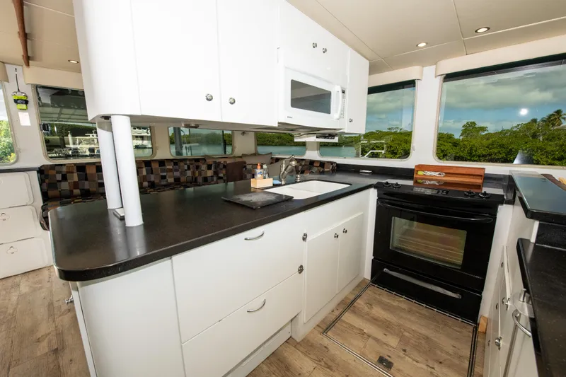 Sarah B Yacht Photos Pics Modern kitchen interior of 2007 Custom Carolina 58 Dixon Marine yacht.