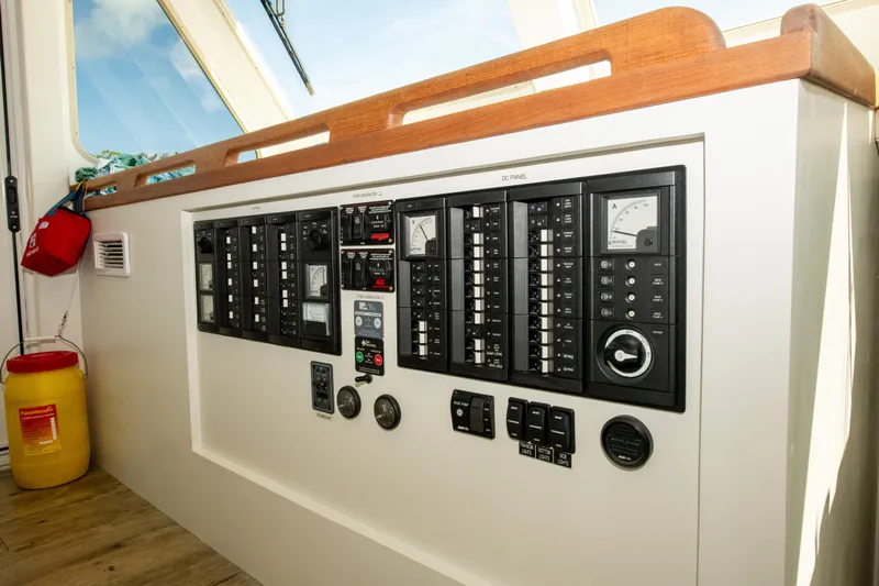 Sarah B Yacht Photos Pics Control panel of 2007 Custom Carolina 58 Dixon Marine boat, featuring various switches and gauges.