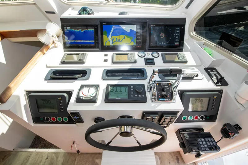 Sarah B Yacht Photos Pics Control panel of 2007 Custom Carolina 58 Dixon Marine boat with navigation and communication equipment.