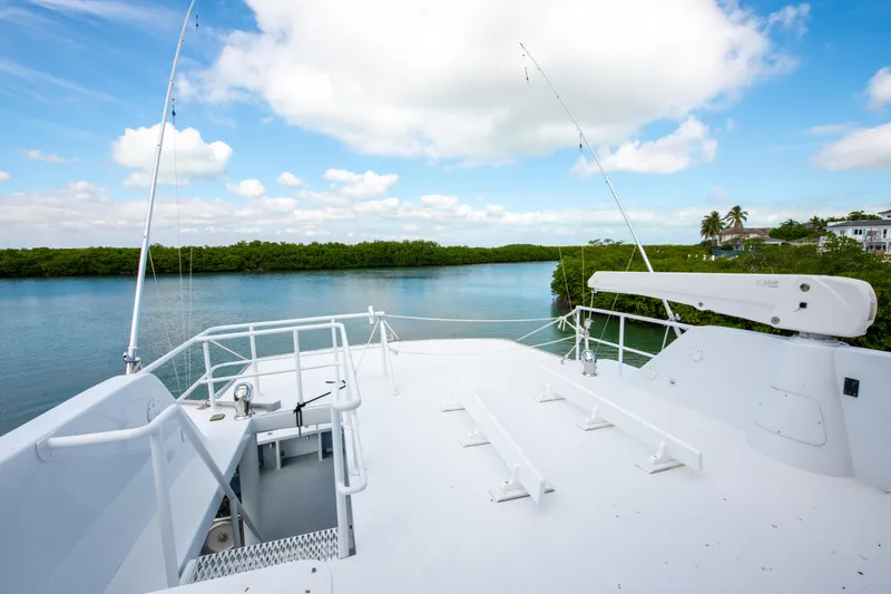 Sarah B Yacht Photos Pics Custom Carolina 58 Dixon Marine 2007 yacht deck overlooking serene waterway and lush greenery.