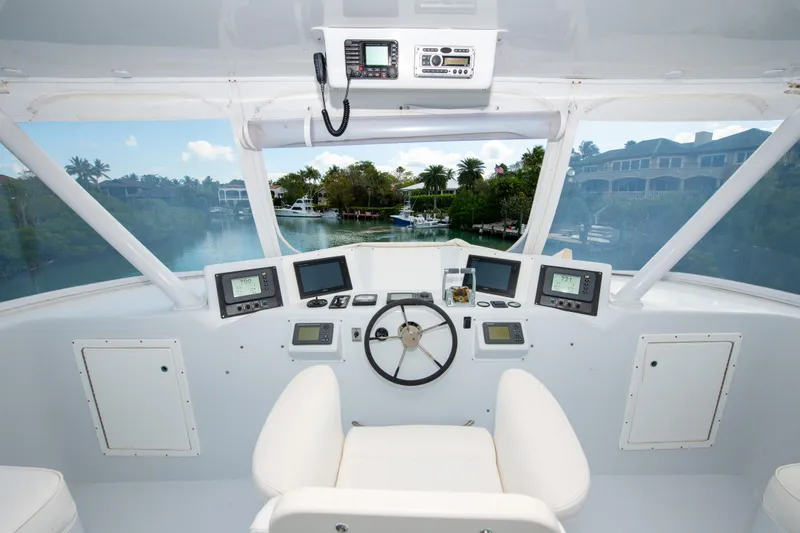 Sarah B Yacht Photos Pics Helm of 2007 Custom Carolina 58 Dixon Marine yacht with navigation equipment.