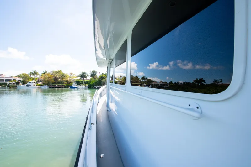 Sarah B Yacht Photos Pics Side view of 2007 Custom Carolina 58 Dixon Marine yacht on calm water.