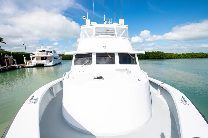 Sarah B Yacht Photos Pics Custom Carolina 58 Dixon Marine 2007 yacht docked in serene waters under blue sky.