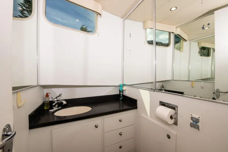 Sarah B Yacht Photos Pics Luxurious bathroom in 2007 Custom Carolina 58 Dixon Marine yacht with sleek design.