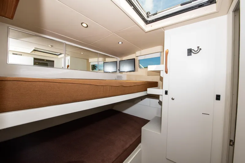 Sarah B Yacht Photos Pics Interior of 2007 Custom Carolina 58 Dixon Marine yacht with bunk beds and skylight.