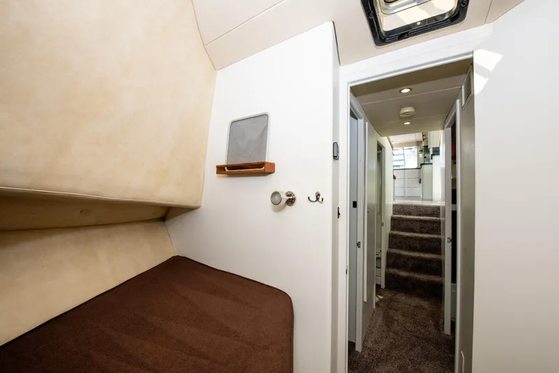 Sarah B Yacht Photos Pics Interior cabin of 2007 Custom Carolina 58 Dixon Marine yacht, featuring cozy sleeping quarters.