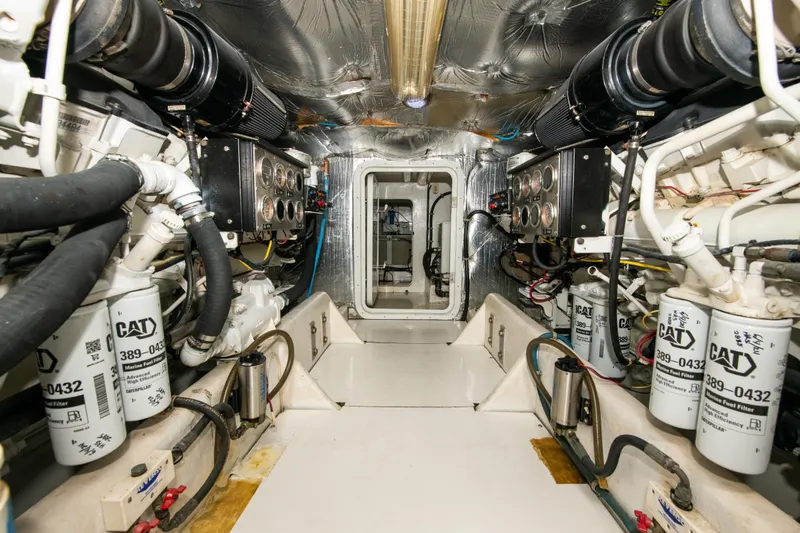 Sarah B Yacht Photos Pics Engine room of 2007 Custom Carolina 58 Dixon Marine, featuring CAT filters and machinery.