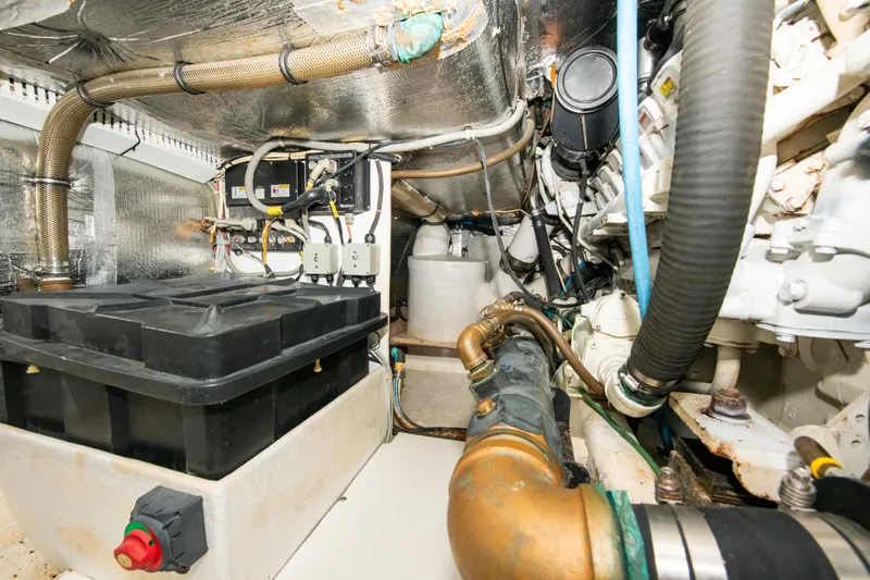 Sarah B Yacht Photos Pics Engine room of 2007 Custom Carolina 58 Dixon Marine, showcasing mechanical components and wiring.