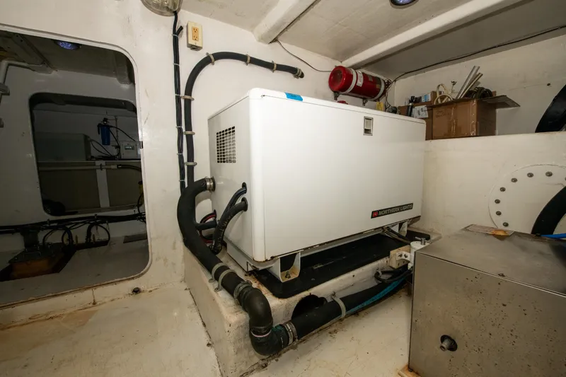 Sarah B Yacht Photos Pics Engine room of 2007 Custom Carolina 58 Dixon Marine with generator and equipment.