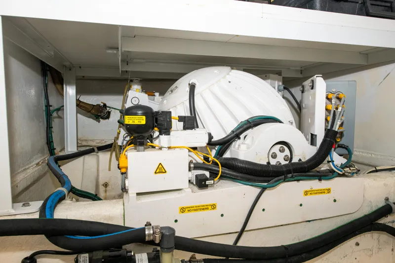 Sarah B Yacht Photos Pics Engine room of 2007 Custom Carolina 58 Dixon Marine, showcasing mechanical components and wiring.