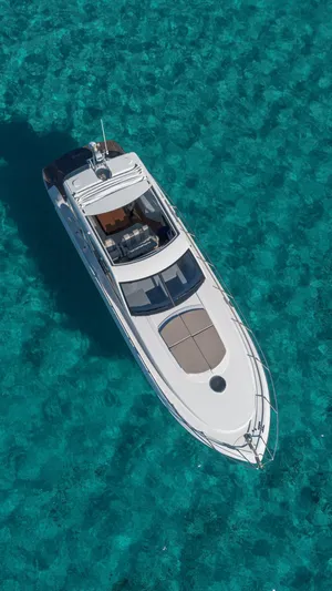 Tyma Yacht Photos Pics Aerial view of 2019 Windy 46 Chinook yacht on clear turquoise water.