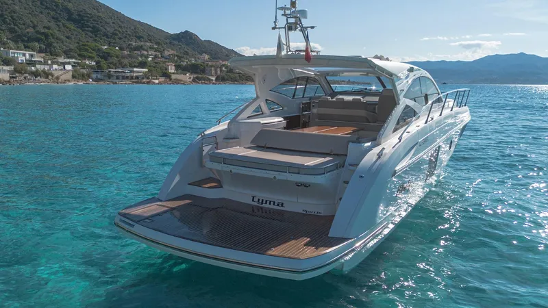 Tyma Yacht Photos Pics Luxurious 2019 Windy 46 Chinook yacht cruising in clear blue waters.