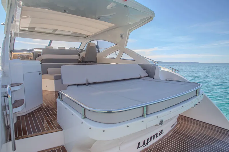 Tyma Yacht Photos Pics Luxurious 2019 Windy 46 Chinook yacht with spacious deck and seating, cruising on clear blue waters.