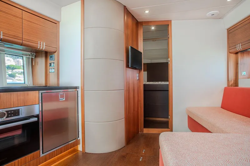 Tyma Yacht Photos Pics Interior of 2019 Windy 46 Chinook yacht with modern kitchen and seating area.