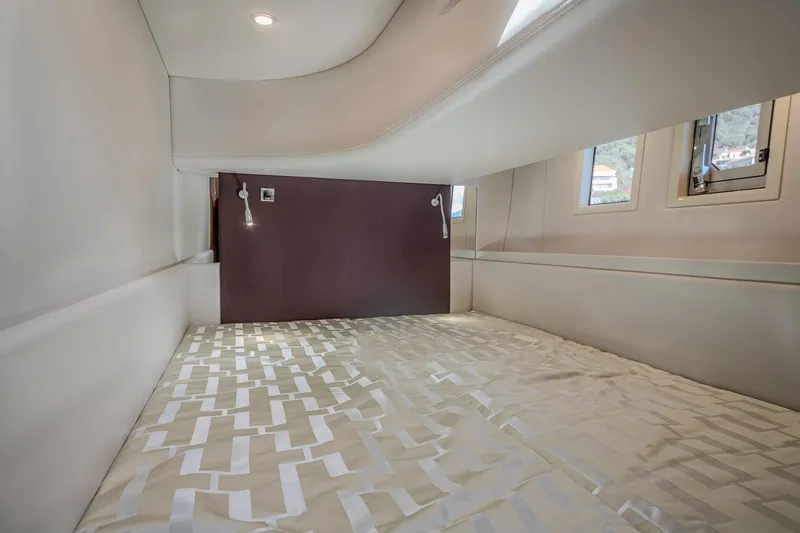 Tyma Yacht Photos Pics Luxurious cabin interior of 2019 Windy 46 Chinook yacht with modern bedding.