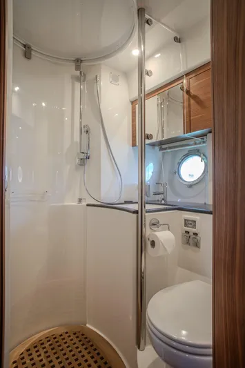 Tyma Yacht Photos Pics Modern bathroom in 2019 Windy 46 Chinook yacht with shower and porthole.