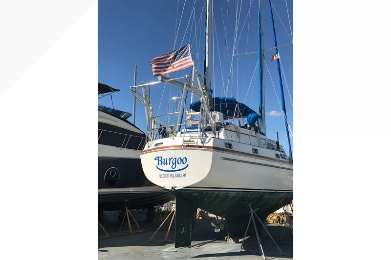 Burgoo Yacht Photos Pics 1980 Gulfstar 47 Sailmaster sailboat on dry dock with American flag.