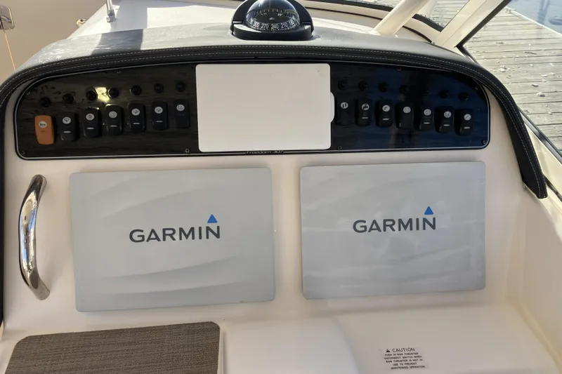  Yacht Photos Pics 2019 Grady-White Freedom 307 dashboard with Garmin navigation displays and control panel.