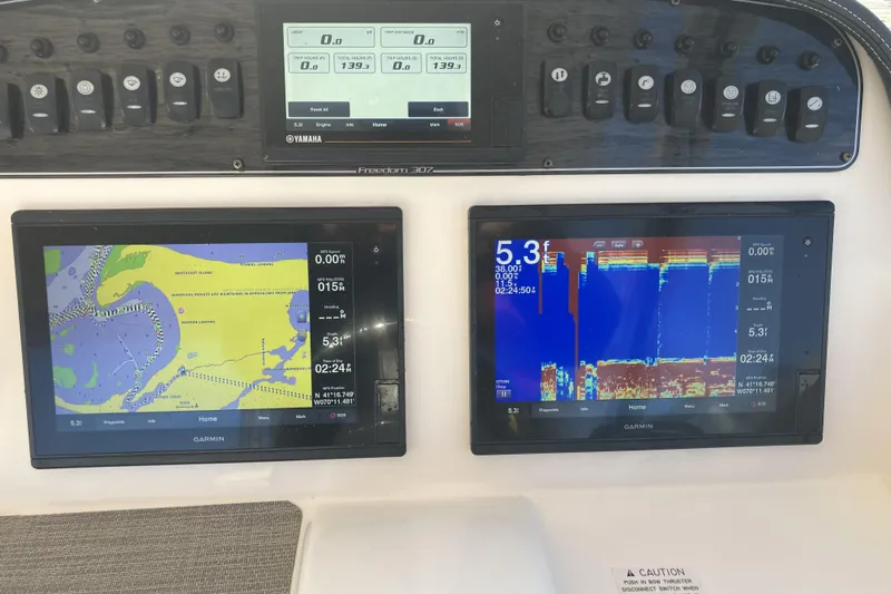  Yacht Photos Pics Grady-White Freedom 307 dashboard with Garmin navigation and sonar displays, 2019 model.