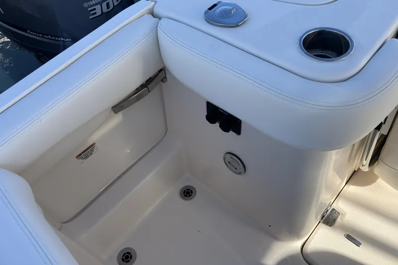  Yacht Photos Pics 2019 Grady-White Freedom 307 boat interior with white seating and cup holder.