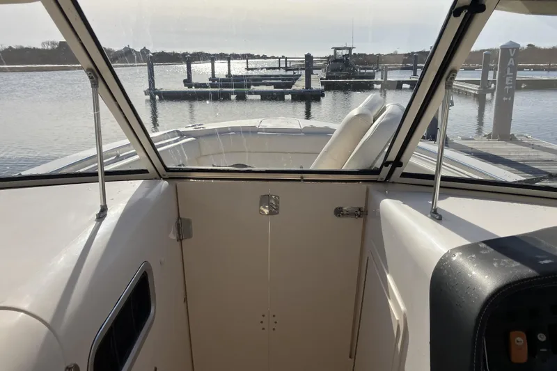  Yacht Photos Pics 2019 Grady-White Freedom 307 boat interior view at marina dock.