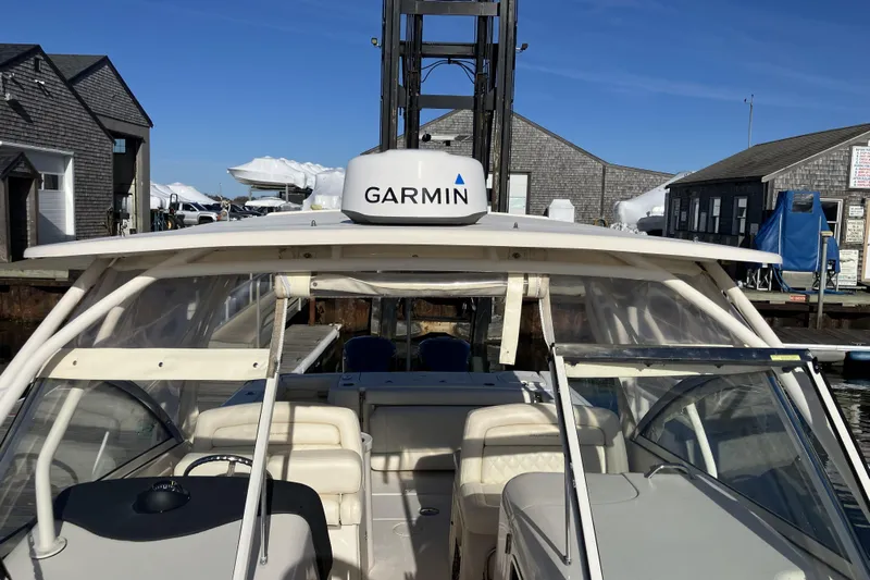  Yacht Photos Pics 2019 Grady-White Freedom 307 boat docked, featuring Garmin equipment.