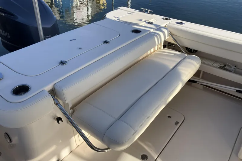  Yacht Photos Pics 2019 Grady-White Freedom 307 boat interior with white seating and cup holders.