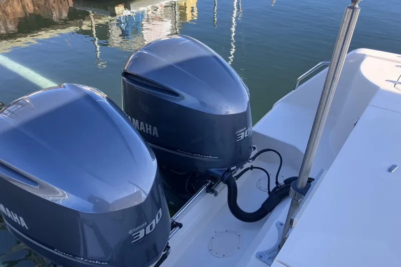  Yacht Photos Pics 2019 Grady-White Freedom 307 with twin Yamaha 300 outboard engines on calm water.