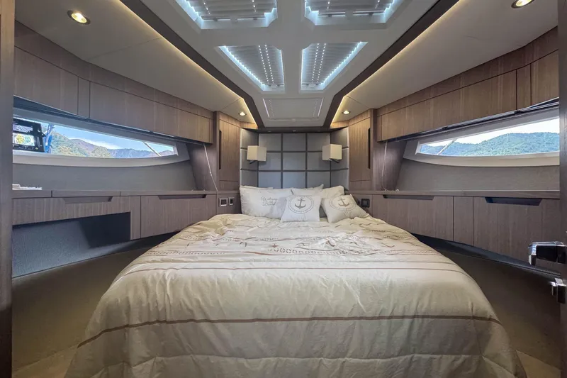 Sea Star Yacht Photos Pics Luxurious bedroom interior of 2023 Galeon 500 Fly yacht with modern design and ambient lighting.