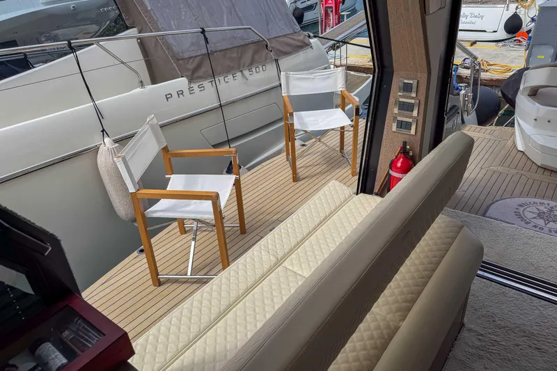 Sea Star Yacht Photos Pics 2023 Galeon 500 Fly yacht deck with chairs and seating area.