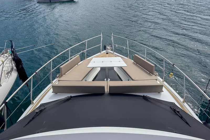 Sea Star Yacht Photos Pics 2023 Galeon 500 Fly yacht bow with sun loungers on calm water.