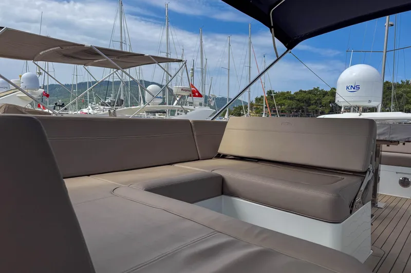 Sea Star Yacht Photos Pics 2023 Galeon 500 Fly yacht with spacious outdoor seating area in marina.