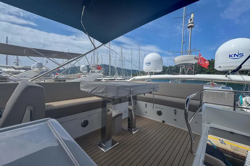 Sea Star Yacht Photos Pics 2023 Galeon 500 Fly yacht deck with seating and table, docked at marina.