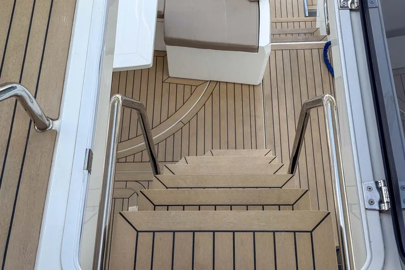 Sea Star Yacht Photos Pics Staircase on 2023 Galeon 500 Fly yacht with elegant wooden decking.
