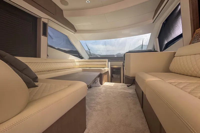 Sea Star Yacht Photos Pics Luxurious interior of 2023 Galeon 500 Fly yacht with elegant seating and panoramic windows.