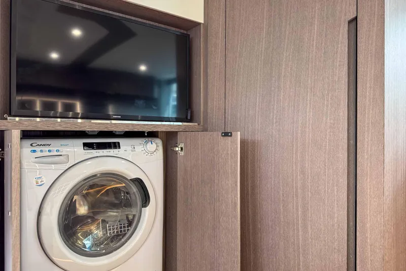 Sea Star Yacht Photos Pics Washing machine and TV in 2023 Galeon 500 Fly yacht interior.