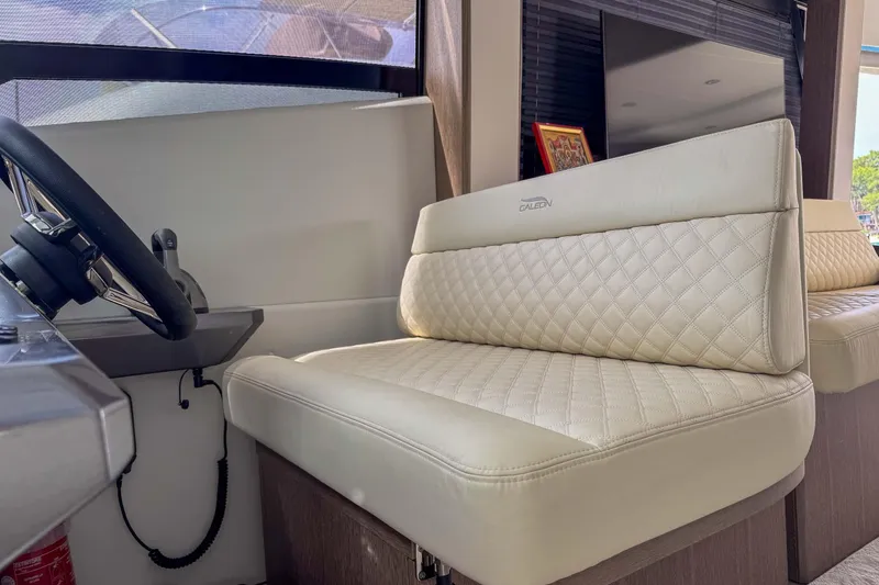 Sea Star Yacht Photos Pics Luxurious interior seating of 2023 Galeon 500 Fly yacht with quilted upholstery.