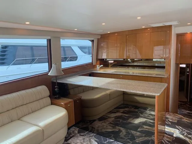  Yacht Photos Pics Luxurious interior of a 2002 Viking 55 Convertible yacht with elegant seating and modern kitchen.