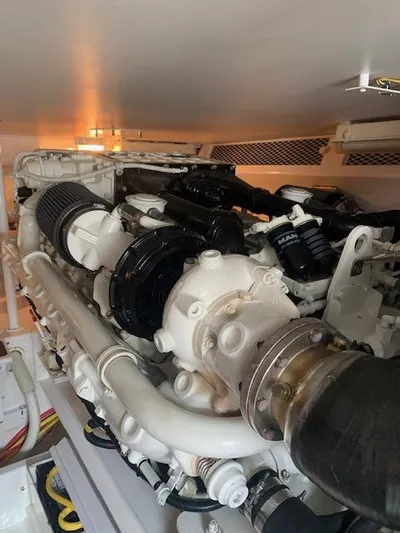  Yacht Photos Pics Engine room of 2002 Viking 55 Convertible yacht, showcasing detailed mechanical components.