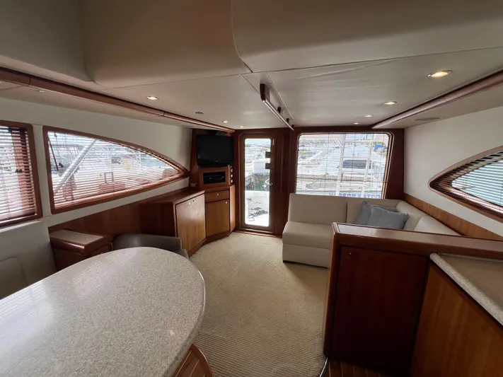 No Name Yacht Photos Pics Luxurious interior of a 2009 Bertram 45 Convertible yacht with elegant wood finishes.