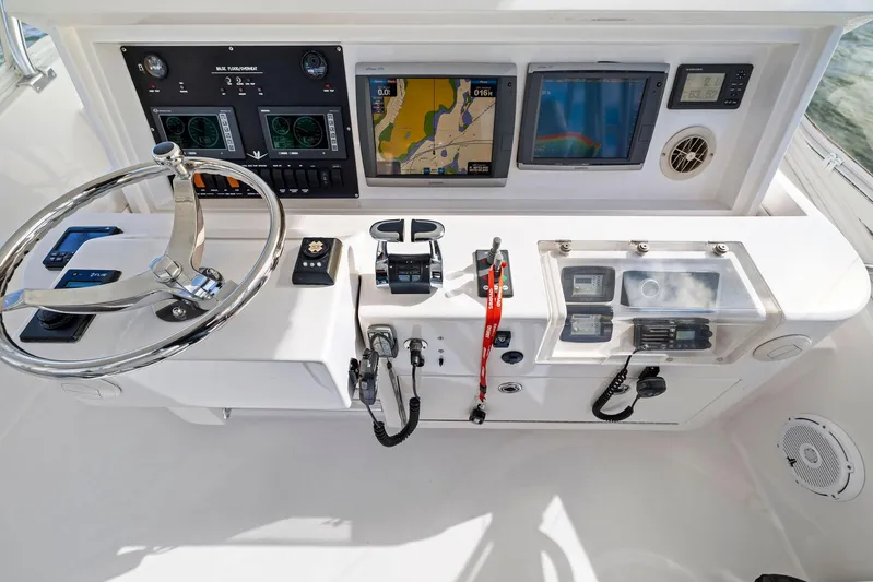 Bella Vita Yacht Photos Pics Bertram Convertible 2010 boat dashboard with navigation and control systems.