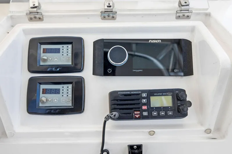 Bella Vita Yacht Photos Pics Bertram 2010 Convertible boat dashboard with electronic controls and radio system.