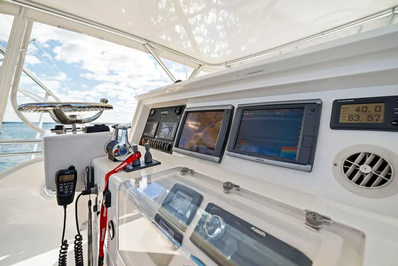 Bella Vita Yacht Photos Pics 2010 Bertram Convertible yacht dashboard with navigation equipment and controls.