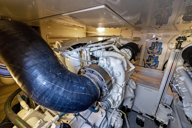 Bella Vita Yacht Photos Pics Engine room of a 2010 Bertram Convertible yacht, showcasing mechanical components.