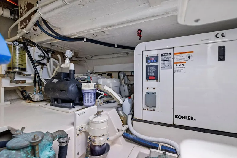 Bella Vita Yacht Photos Pics Engine room of 2010 Bertram Convertible with Kohler generator and mechanical components.