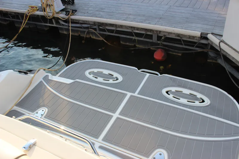  Yacht Photos Pics 2012 Sea Ray 330 Sundancer swim platform at dock with water and buoy.