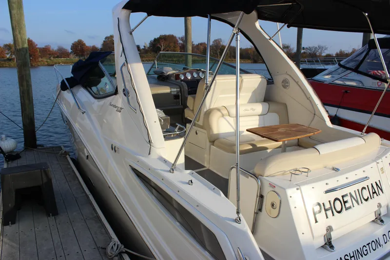  Yacht Photos Pics 2012 Sea Ray 330 Sundancer docked, featuring spacious seating and elegant design.